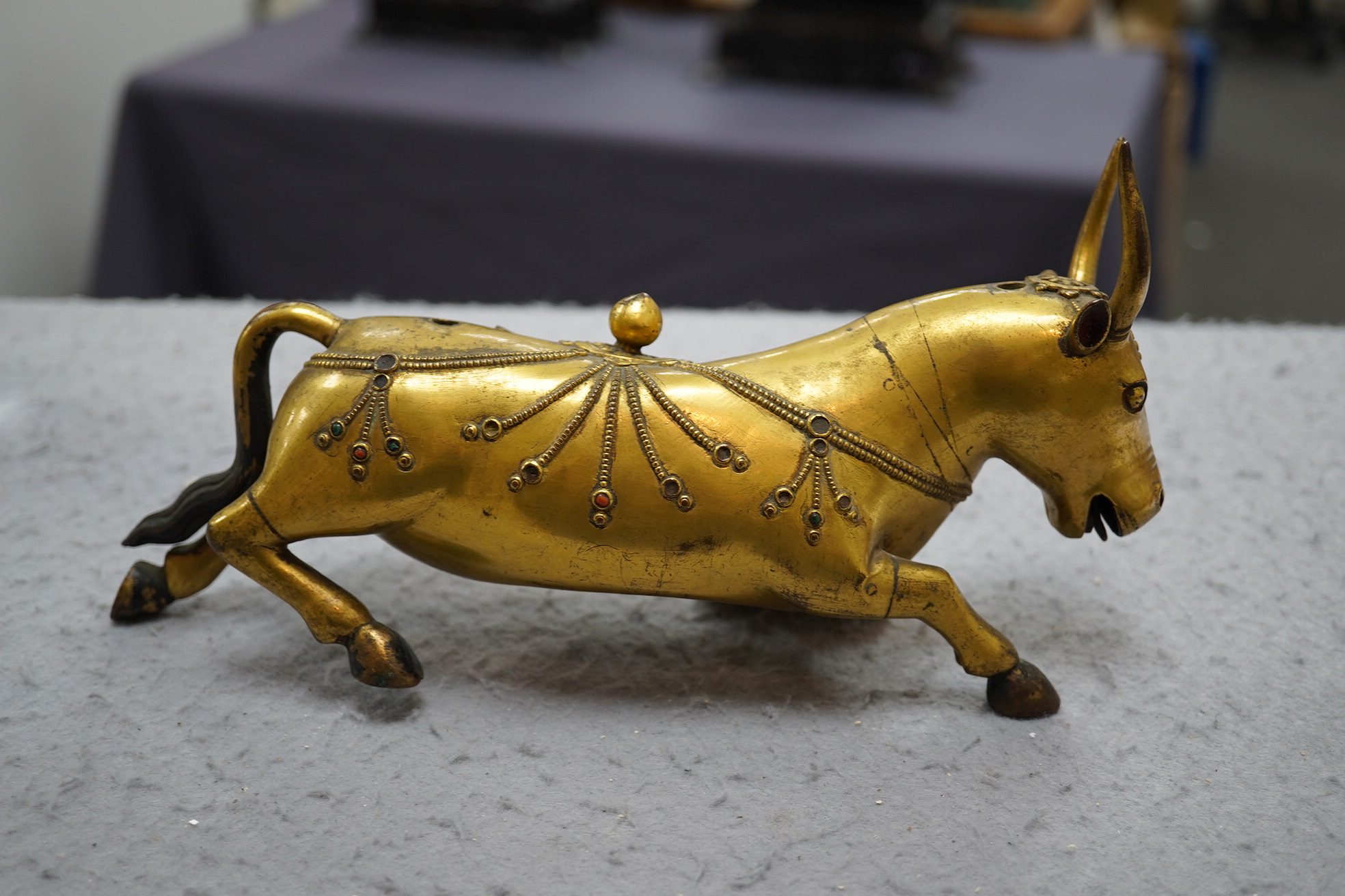 A Tibetan gilt bronze figure of a buffalo, 18th century